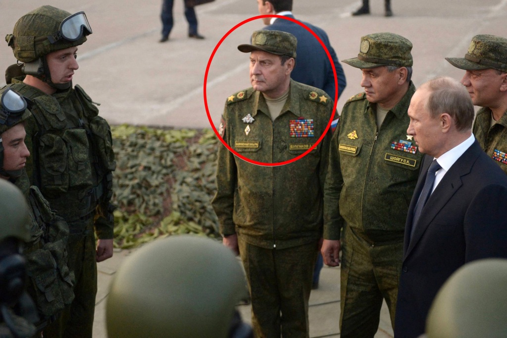Army General Dmitry Bulgakov (circled) stands with president Vladimir Putin in 2015.